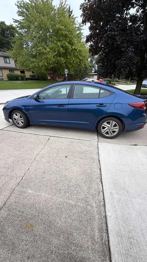 Blue Hyundai Elantra, side view