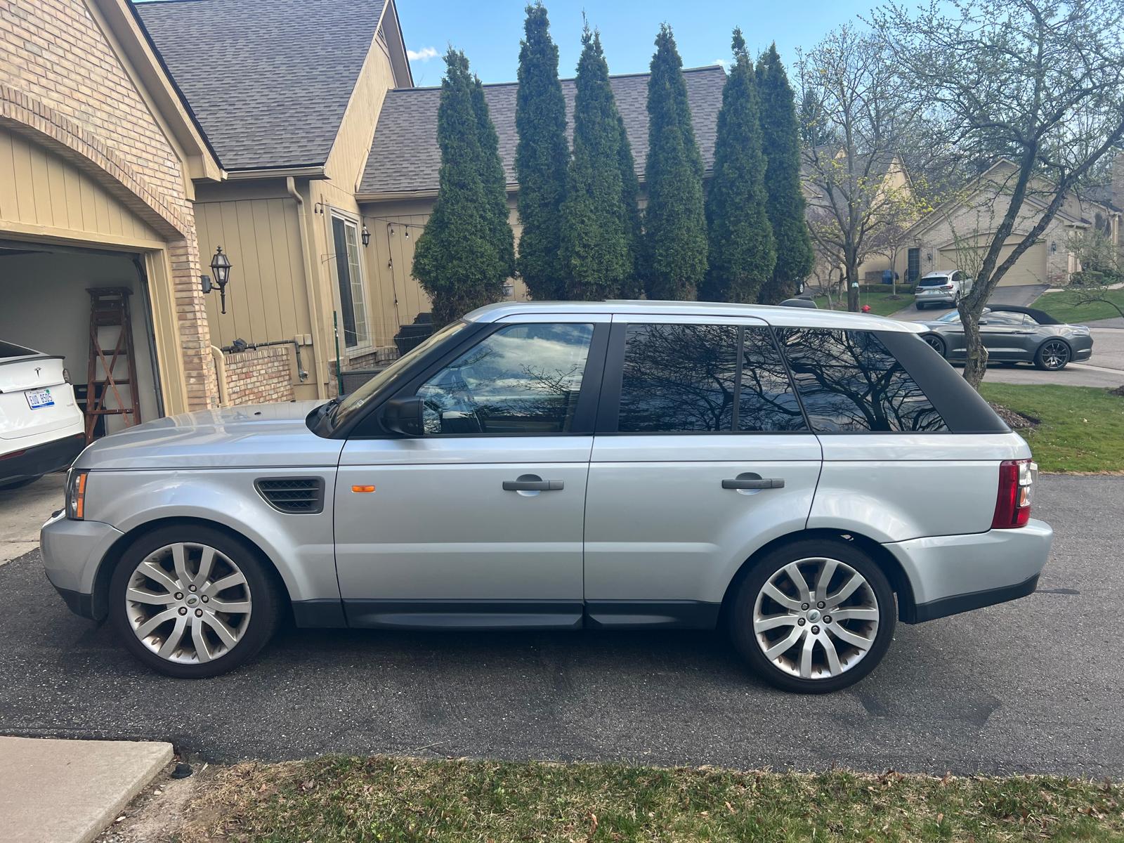 Silver Range Rover Sport HSE, driver-side view